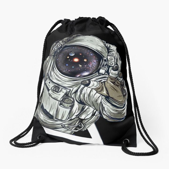 Astronaut touching the Universe drawstring bag